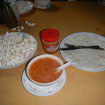 Occasionally popcorn would magically appear - a welcome treat. The red water was euphemistically described as "tomato soup". Once again chapati and peanut butter to the rescue.