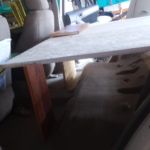 Dramatic increase in storage space without the seats. The piece of wood on top is hinged and flips forward to provide me with additional length.