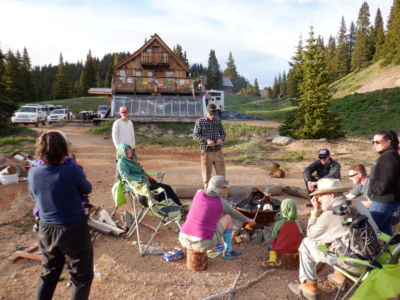 Relaxing around a fire after a long, busy day. St Paul Lodge in the background.