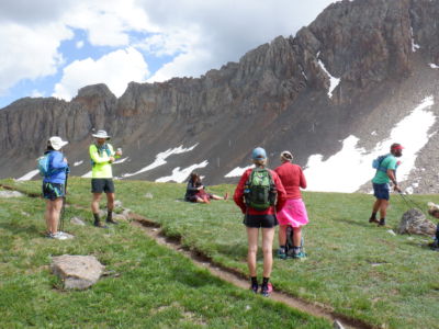Fellow hikers dealing with hail by upper Blue Lakes