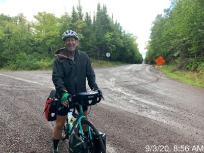 Still smiling in spite of rain, wind, mud and flat tires.